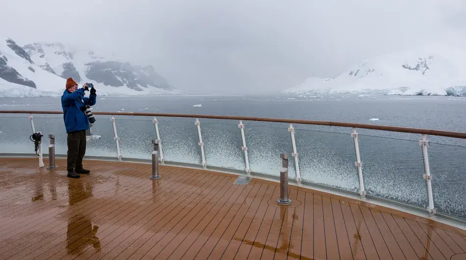 Passenger standing on the outer deck on Ocean Victory
